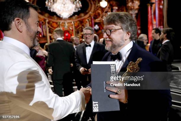 In this handout provided by A.M.P.A.S., Jimmy Kimmel and Guillermo del Toro attend the 90th Annual Academy Awards at the Dolby Theatre on March 4,...