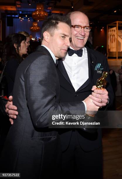 Actors Sam Rockwell and Richard Jenkins share a hug at the 90th Annual Academy Awards Governors Ball at Hollywood & Highland Center on March 4, 2018...