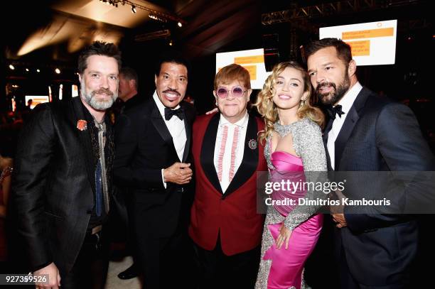 Rufus Wainwright, Lionel Richie, Sir Elton John, Miley Cyrus, and Ricky Martin attend the 26th annual Elton John AIDS Foundation Academy Awards...