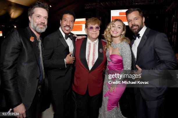 Rufus Wainwright, Lionel Richie, Sir Elton John, Miley Cyrus, and Ricky Martin attend the 26th annual Elton John AIDS Foundation Academy Awards...