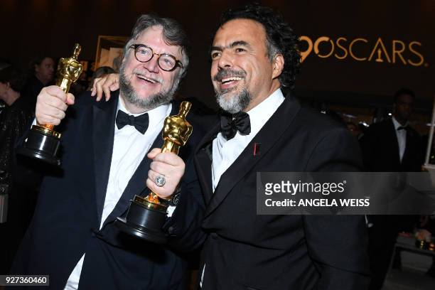 Best Director and Best Film laureate Mexican director Guillermo del Toro and Mexican director Alejandro Gonzalez Inarritu attend the 90th Annual...
