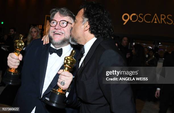 Best Director and Best Film laureate Mexican director Guillermo del Toro and Mexican director Alejandro Gonzalez Inarritu attend the 90th Annual...