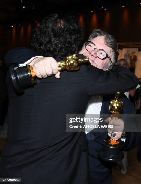 Best Director and Best Film laureate Mexican director Guillermo del Toro and Mexican director Alejandro Gonzalez Inarritu attend the 90th Annual...