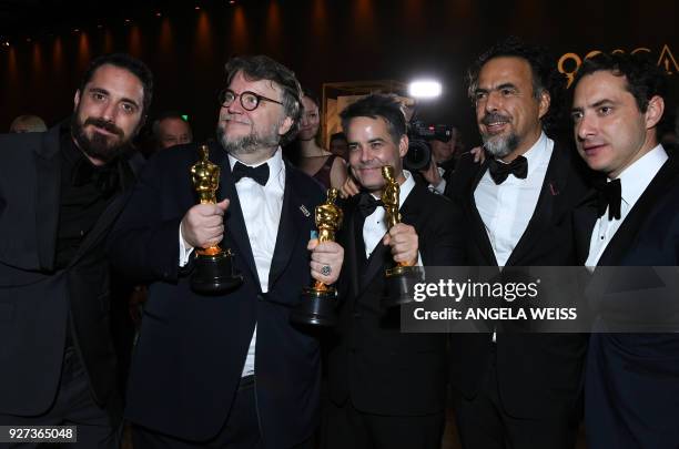 Best Director and Best Film laureate Mexican director Guillermo del Toro and Mexican director Alejandro Gonzalez Inarritu attend the 90th Annual...