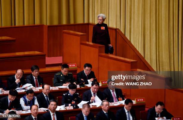 Fu Ying, former spokesperson for the fourth session of China's 12th National People's Congress watches during the opening session of the National...