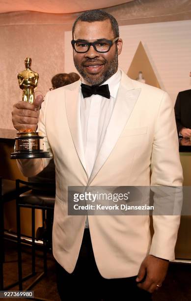 Writer Jordan Peele, winner of the Best Original Screenplay award for 'Get Out,' poses with award at the 90th Annual Academy Awards Governors Ball at...