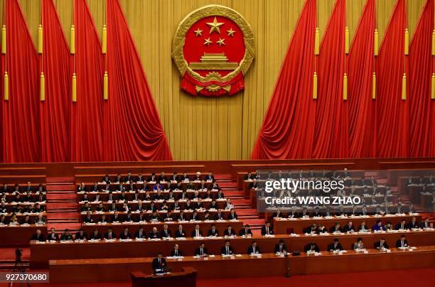 Chinese Premier Li Keqiang delivers his work report during the opening session of the National People's Congress, China's legislature, in Beijing's...