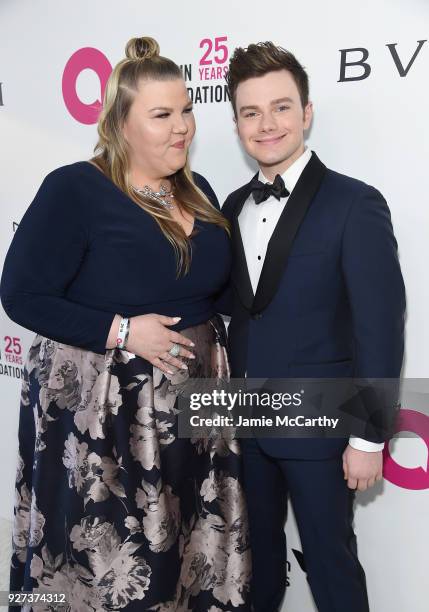Ashley Fink and Chris Colfer attend the 26th annual Elton John AIDS Foundation Academy Awards Viewing Party sponsored by Bulgari, celebrating EJAF...
