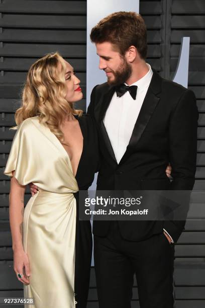 Miley Cyrus and Liam Hemsworth attend the 2018 Vanity Fair Oscar Party hosted by Radhika Jones at Wallis Annenberg Center for the Performing Arts on...