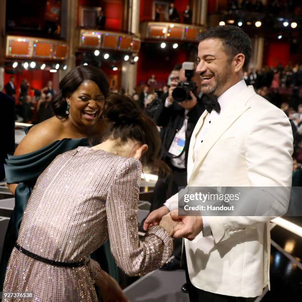 In this handout provided by A.M.P.A.S., Octavia Spencer, Sally Hawkins and Jimmy Kimmel attend the 90th Annual Academy Awards at the Dolby Theatre on...