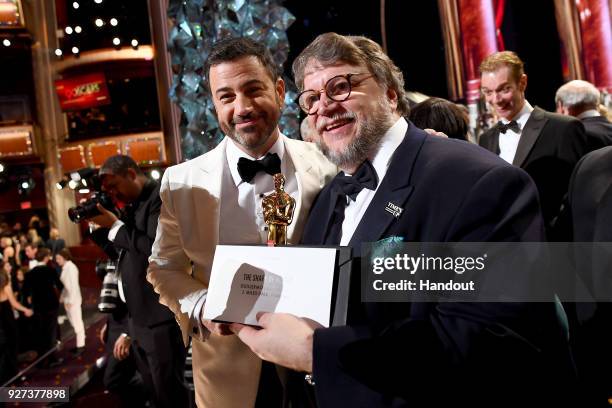 In this handout provided by A.M.P.A.S., Jimmy Kimmel and Guillermo del Toro attend the 90th Annual Academy Awards at the Dolby Theatre on March 4,...