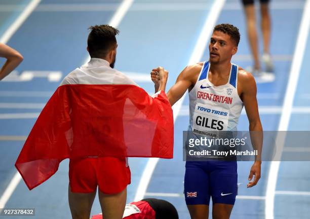 Adam Kszczot of Poland is congratulated by Elliot Giles of Great Britain after winning the Men's 800m Final during Day Three of the IAAF World Indoor...