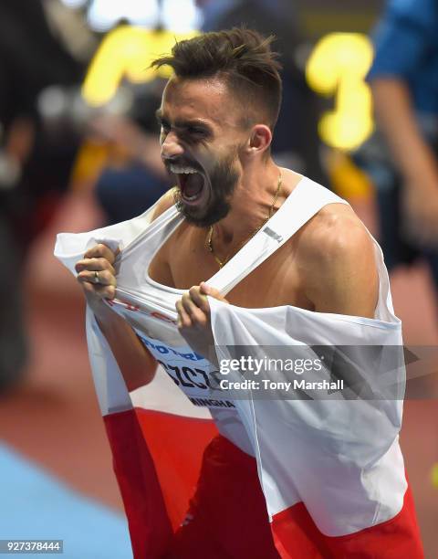 Adam Kszczot of Poland celebrates winning the Men's 800m Final during Day Three of the IAAF World Indoor Championships at Arena Birmingham on March...