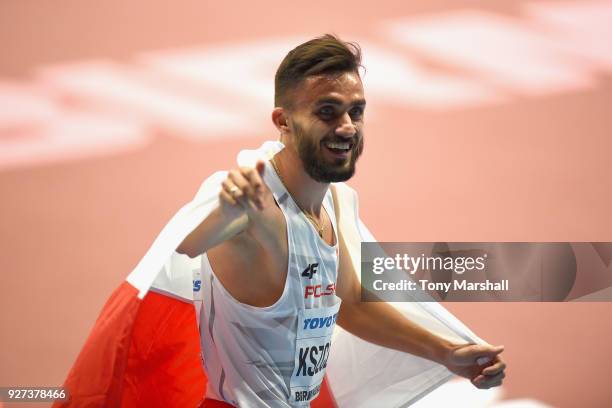 Adam Kszczot of Poland celebrates winning the Men's 800m Final during Day Three of the IAAF World Indoor Championships at Arena Birmingham on March...