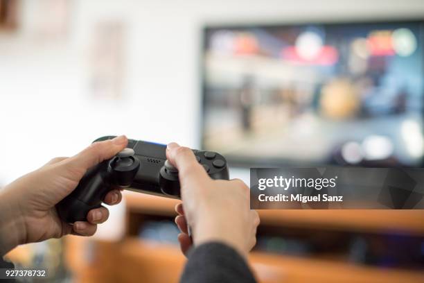 videogames joystick - smart tv living room stock pictures, royalty-free photos & images