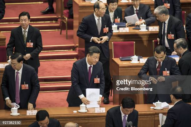 Zhang Dejiang, chairman of the Standing Committee of the National People's Congress , left, Xi Jinping, China's president, center, and Li Keqiang,...