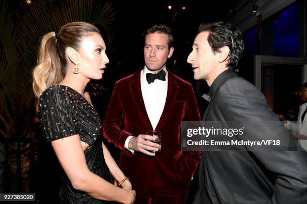 Elizabeth Chambers, Armie Hammer and Adrien Brody attend the 2018 Vanity Fair Oscar Party hosted by Radhika Jones at Wallis Annenberg Center for the...