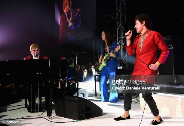 Sir Elton John, Sam Kiszka and Joshua Kiszka perform during the Elton John AIDS Foundation 26th Annual Academy Awards Viewing Party at The City of...