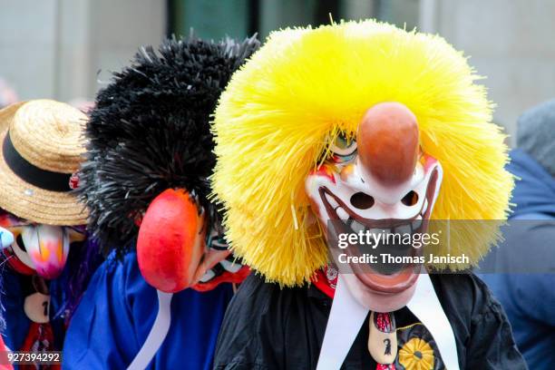 two waggis during the parade of the basler fasnacht - waggis stock pictures, royalty-free photos & images