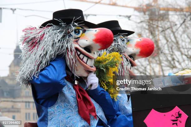 two waggis on a carriage during the parade of the basler fasnacht - waggis stock pictures, royalty-free photos & images
