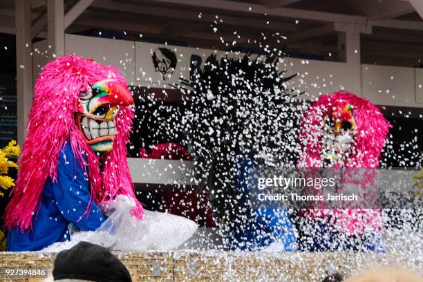 waggis throwing confetti during the parade of the basler fasnacht - waggis stock pictures, royalty-free photos & images