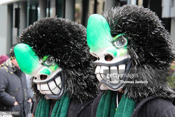 two waggis with big smiles during the parade of the basler fasnacht - waggis stock pictures, royalty-free photos & images