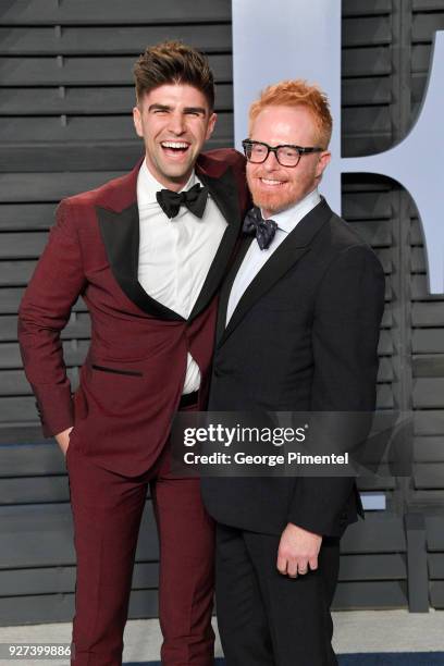 Justin Mikita and Jesse Tyler Ferguson attend the 2018 Vanity Fair Oscar Party hosted by Radhika Jones at Wallis Annenberg Center for the Performing...