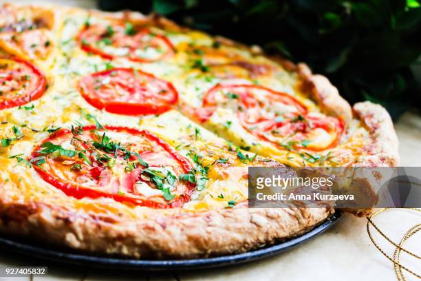 picnic food. homemade puff pastry pizza pie with cream cheese and dill filling, mozzarella cheese, tomatoes, fresh parsley, selective focus. for breakfast and lunch. - pizza crust stock pictures, royalty-free photos & images