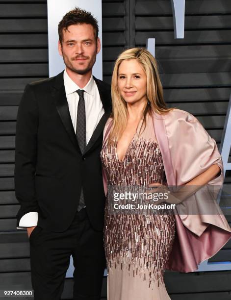 Christopher Backus and Mira Sorvino attend the 2018 Vanity Fair Oscar Party hosted by Radhika Jones at Wallis Annenberg Center for the Performing...