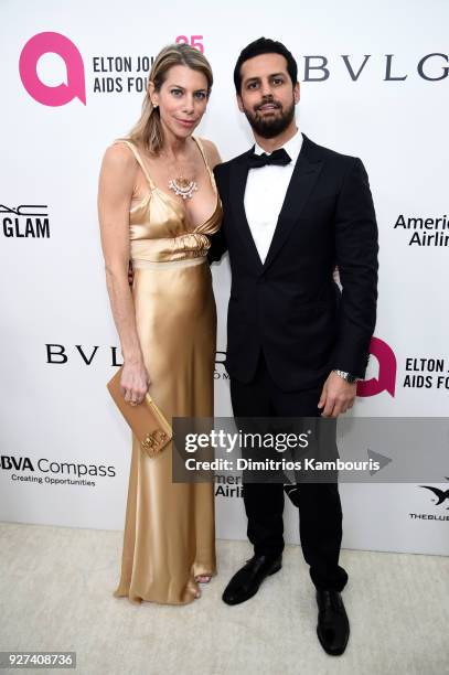 Sarah Gargano and Maz Zouhairi attend the 26th annual Elton John AIDS Foundation Academy Awards Viewing Party sponsored by Bulgari, celebrating EJAF...