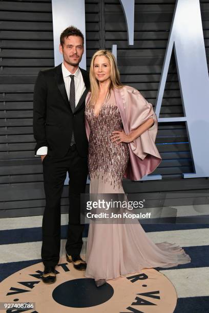 Christopher Backus and Mira Sorvino attend the 2018 Vanity Fair Oscar Party hosted by Radhika Jones at Wallis Annenberg Center for the Performing...