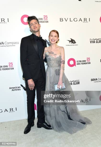 Travis Mills and Madelaine Petsch attend the 26th annual Elton John AIDS Foundation's Academy Awards Viewing Party at The City of West Hollywood Park...