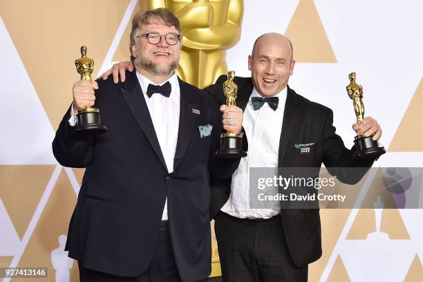 Guillermo del Toro and J. Miles Dale attend the 90th Annual Academy Awards - Press Room on March 4, 2018 in Hollywood, California.