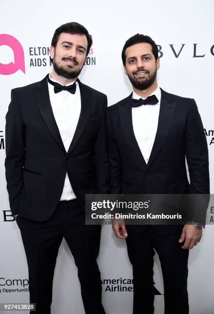 Guest and Maz Zouhairi attend the 26th annual Elton John AIDS Foundation Academy Awards Viewing Party sponsored by Bulgari, celebrating EJAF and the...