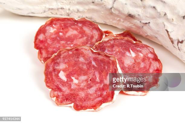 pile of red salami - embutido stock-fotos und bilder