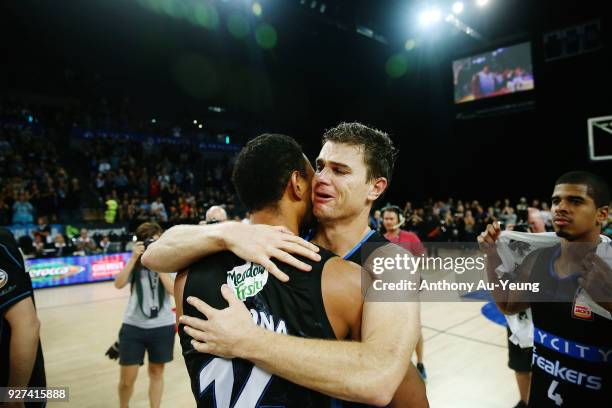 Kirk Penney of the Breakers shares a hug with teammate Mika Vukona after game two of the NBL semi final series between Melbourne United and the New...