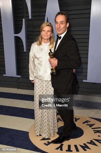 Dominique Lemonnier and Alexandre Desplat attend the 2018 Vanity Fair Oscar Party hosted by Radhika Jones at the Wallis Annenberg Center for the...