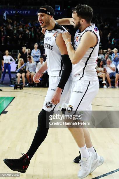 Josh Boone celebrates with Peter Hooley of United after winning game two of the NBL semi final series between Melbourne United and the New Zealand...