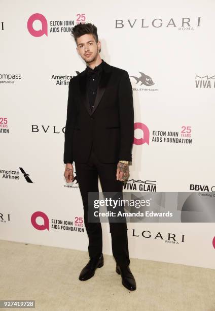 Actor Travis Mills arrives at the 26th Annual Elton John AIDS Foundation's Academy Awards Viewing Party on March 4, 2018 in West Hollywood,...