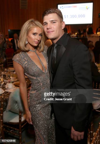 Paris Hilton and Chris Zylka attend Byron Allen's Oscar Gala Viewing Party to Support The Children's Hospital Los Angeles at the Beverly Wilshire...