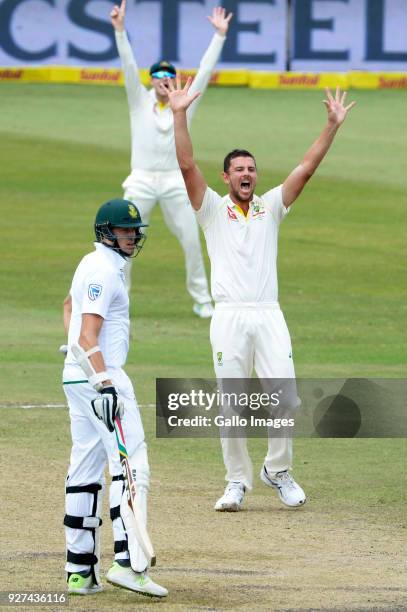 Josh Hazlewood of Australia celebrates the wicket of Quinton de Kock of the Proteas during day 5 of the 1st Sunfoil Test match between South Africa...
