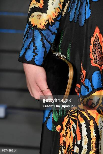 Hari Nef, jewelry and clutch detail, attends the 2018 Vanity Fair Oscar Party hosted by Radhika Jones at Wallis Annenberg Center for the Performing...