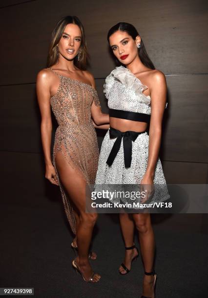 Alessandra Ambrosio and Sara Sampaio attends the 2018 Vanity Fair Oscar Party hosted by Radhika Jones at Wallis Annenberg Center for the Performing...