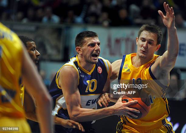 Baskets Oldenburg's Milan Majstorovic vies with Moscow region BC Khimiki's Paulius Jankunas during their Euroleague group D basketball math in...