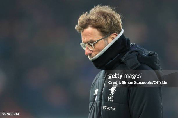 Liverpool manager Jurgen Klopp wears a snood before the Premier League match between Liverpool and Newcastle United at Anfield on March 3, 2018 in...