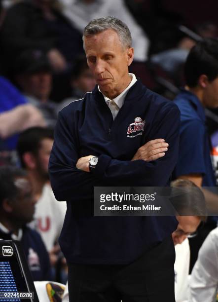 Head coach Mike Dunlap of the Loyola Marymount Lions stands on the sideline during a quarterfinal game of the West Coast Conference basketball...