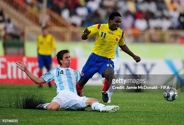 Frederico Rasmussen of Argentina tackles Wilson Cuero of Colombia during the Round of 16 match between Argentina and Colombia at the Gateway...