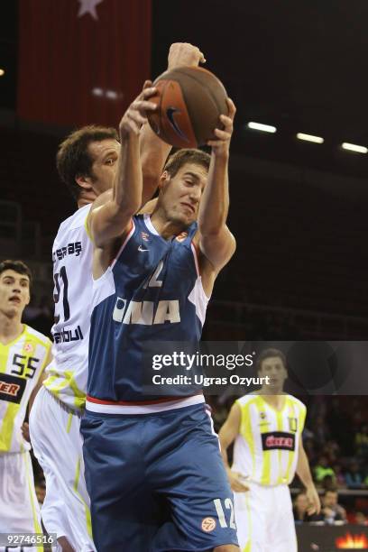 Luksa Andric, #12 of Cibona competes with Oguz Savas, #21 of Fenerbahce Ulker during the Euroleague Basketball Regular Season 2009-2010 Game Day 3...