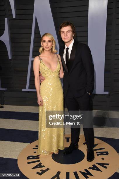 Emma Roberts and Evan Peters attend the 2018 Vanity Fair Oscar Party hosted by Radhika Jones at the Wallis Annenberg Center for the Performing Arts...