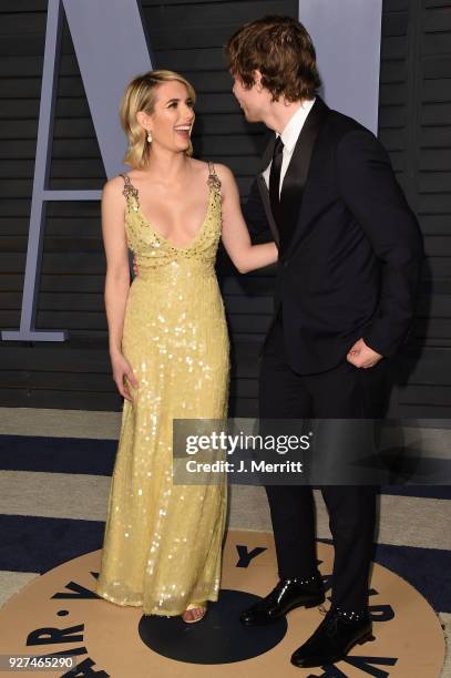 Emma Roberts and Evan Peters attend the 2018 Vanity Fair Oscar Party hosted by Radhika Jones at the Wallis Annenberg Center for the Performing Arts...